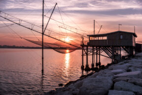 What are trabocchi (or trabucchi), and where does their name come from?